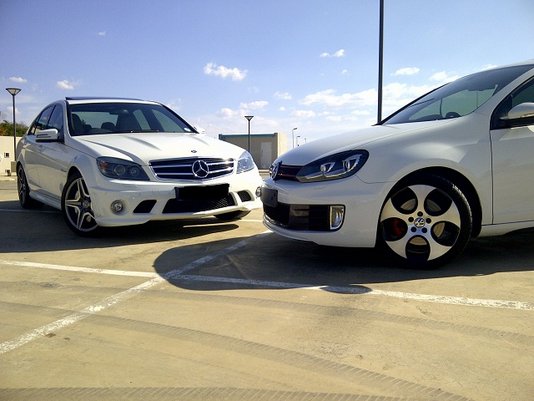 VW Golf 6 GTI DSG and a Mercedes-Benz C63 AMG Close up